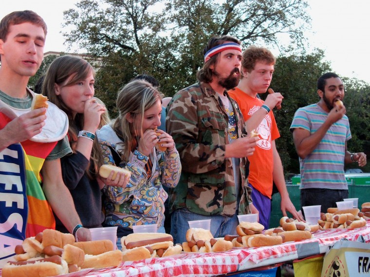 Contestants eat as many veggie dogs as they can in hopes of winning.
