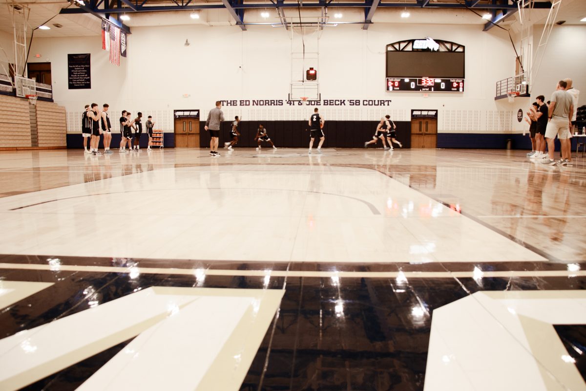 The St. Edward’s Men’s Basketball team practices at the newly renamed “Ed Norris ‘41 and Joe Beck ‘58 Court” in the Recreation and Athletic Center. John Lucas was a member of the search committee in 2009 that ultimately hired Andre Cook as head men’s basketball coach.