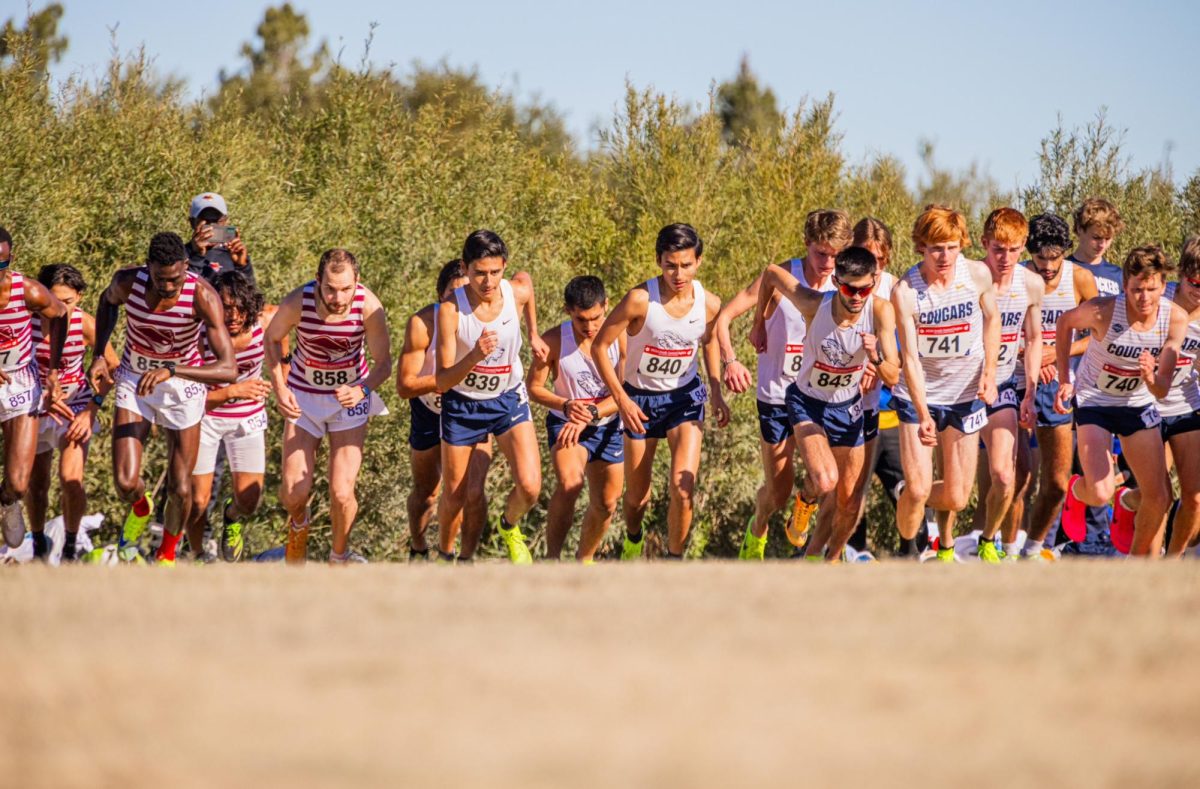 Omar and Ivan Guzman (center) at the starting line, racing for the St. Edward’s cross-country team.