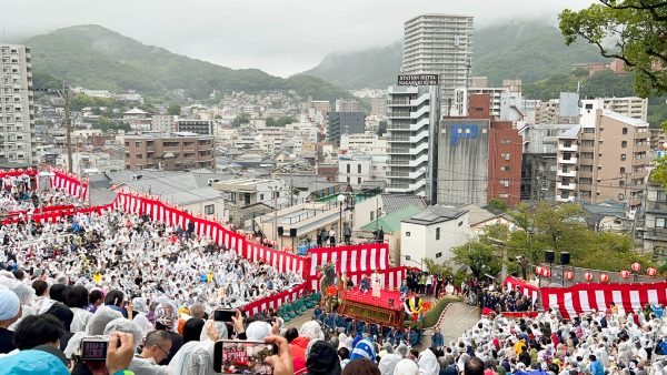 The third float of the opening ceremony for the Okunchi Festival. The festival is a famous three day cultural and religious celebration in Nagasaki. During the event, food stalls can be found in certain stretches of downtown and the parade floats are carried all throughout the city.