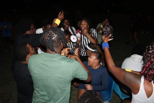 Musical chairs winner, Giselle Haley, smiles as controversy erupts over her win. Musical chairs was the last game played with only two points between the lead red team and the rest of the teams.