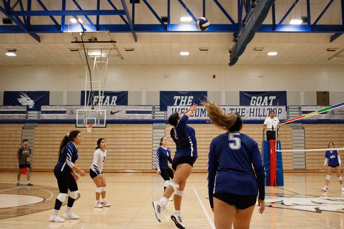 Melanee Vargas is about to spike the ball that SPC won't be able to receive. Scoring the point for SEU and pulling ahead of SPC. After scoring Melanee is up to serve.