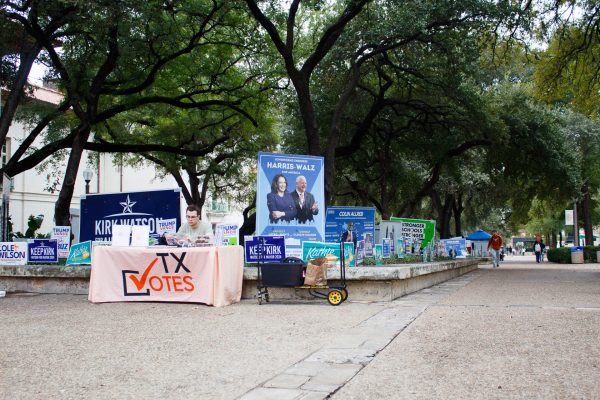 Political signs advertising local Austin, Travis County and national political candidates near polling locations on Election Day at the University of Texas at Austin. Both Republican and Democratic candidates are represented on the political advertisements. Students at booths were encouraging other UT students and faculty to vote.