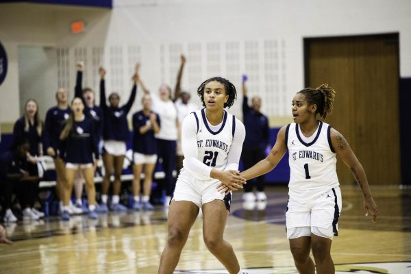 Bailey Featherstone (21) and J.P. (1) celebrate a basket against Colorado School of Mines. Featherstone and J.P. were both named to last year’s Lone Star Conference All-Freshman Team.