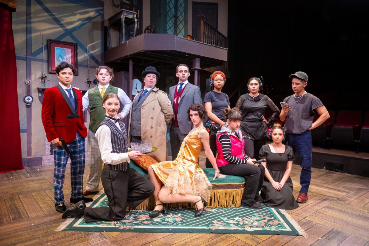 The cast of “The Play That Goes Wrong” reproduction of the iconic picture in front of the set still standing. 