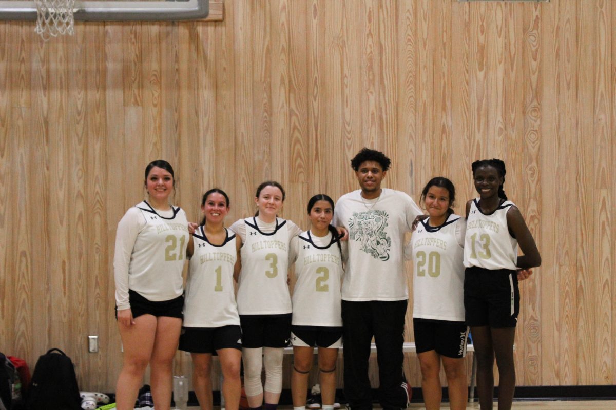 The women’s club basketball team poses after their first win of the season. “These girls come into practice and they work hard every single time,” Rae said. “They take their time out of their day outside of practice to work on their skills too, so they're not only coming to practice and working hard, but they're doing it on their own time too. They have a lot of dedication, they have commitment, and that's all I could ask for. They work really hard in practice. They help each other out. We're in practice, and if someone is struggling, whether it's a bad day or they just can't get a skill down, some of the other teammates are there to help 'em, pick 'em up, show 'em how to do it. We work as one unit and these girls have put in so much hard work, and even with just six of us, we have grown so much. And tonight we pulled off this win. And I think that it also wouldn't be fun without them. They have such great energy, especially in practice, keeping it lighthearted. We're always supporting each other, we're always making each other laugh, and it's just all making it worth it. And that's why I do this. That's why I want to manage the team, so that I can make the program possible for them to play.”