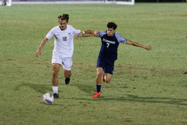 Forward Arthur Souza maintains the pressure on Mustang Cooper Tea. Souza finished the season earning an All-Conference First Team award, as well as the Academic Player of the Year.