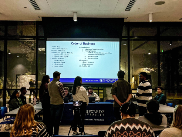 SGA members gather for their first meeting of the semester, inducting five new students into the senate. 