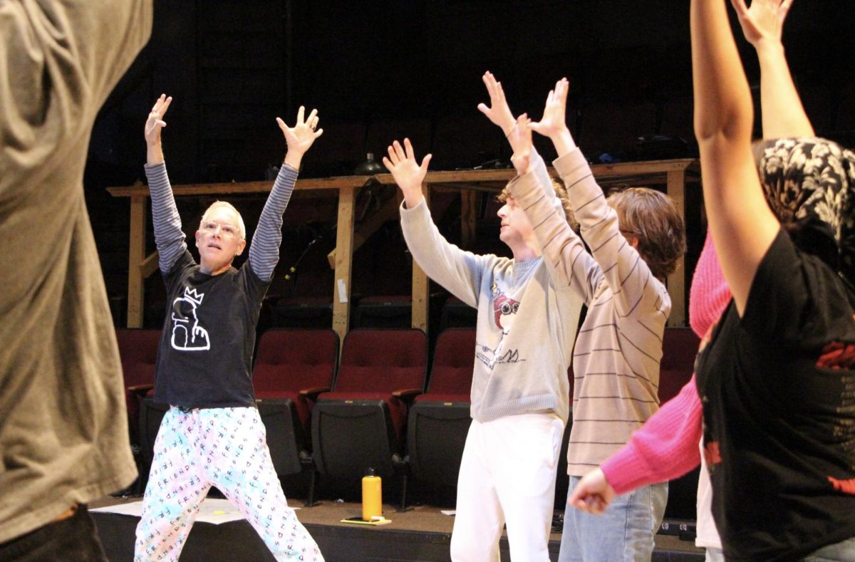 Director C. Patrick Gendusa leads cast members in an opening exercise at the beginning of rehearsal. The exercises serve as a gateway for actors to get comfortable before rehearsing scenes and musical numbers.