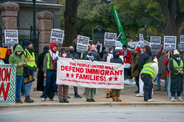 Demonstrators from the Party for Socialism and Liberation protest against President Donald Trump’s controversial and restrictive immigration policy in front of the State Capitol building in Austin, Texas on Inauguration Day.