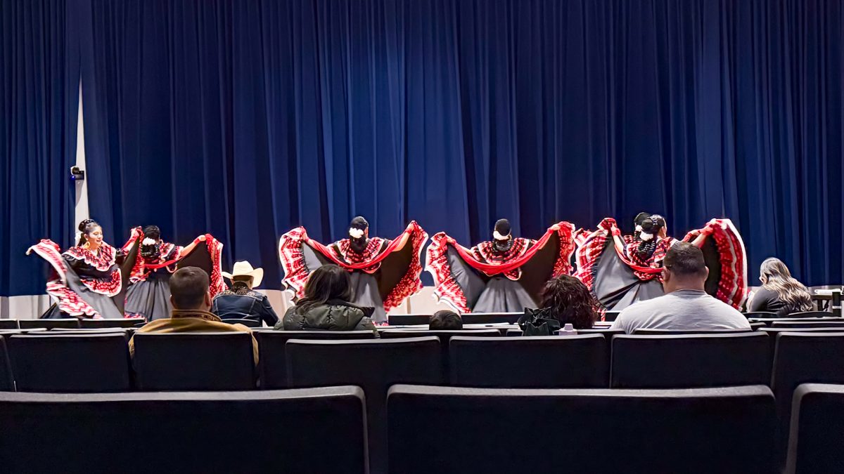 Student dancers start the first day of the competition showcasing the Sinaloa Costa ballet style in the traditional headpiece and dress. This particular style of dance hails from the northwestern Mexican state of Sinaloa, representing the culture and environment through vibrant colors and elegant technique.