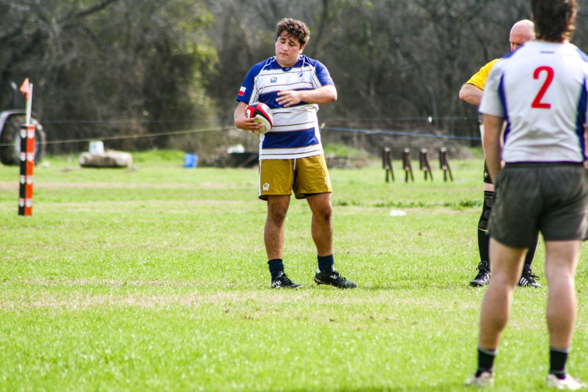 Captain Vitores holds the oblong rugby ball in his last game of his senior year, Vitores has played rugby all of his life and plays professionally back home in Chile. With his graduation incoming, it is unclear who will become captain of the team next semester.