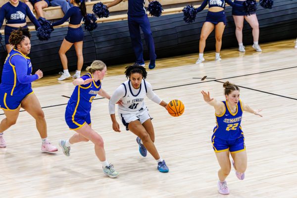 Bailey Featherstone gearing up to score during a hard-fought battle against St. Mary’s in the Battle of the Saints. The sophomore standout led St. Edward’s with 20 points and nine rebounds, showcasing her impact on both ends of the court.