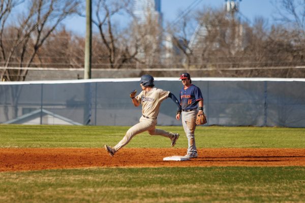 Catcher Diego Solis runs by second base, later scoring one of the two runs for the Hilltoppers. In the bottom of the fifth inning, Trevor Sebek hit the ball to right-center field, allowing both Solis and Nicholas Anderson to put St. Edward’s in the scoreboard.