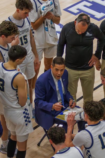 Head coach Andre Cook guides the team in a timeout called at the last home game of the season, a Battle of the Saints match against St. Mary’s University. On Feb. 26, the team secured a valuable win that not only allowed them to secure the 5th seed in the 2025 Lone Star Conference Playoffs, but also to continue to expand Coach Cook’s winning record.