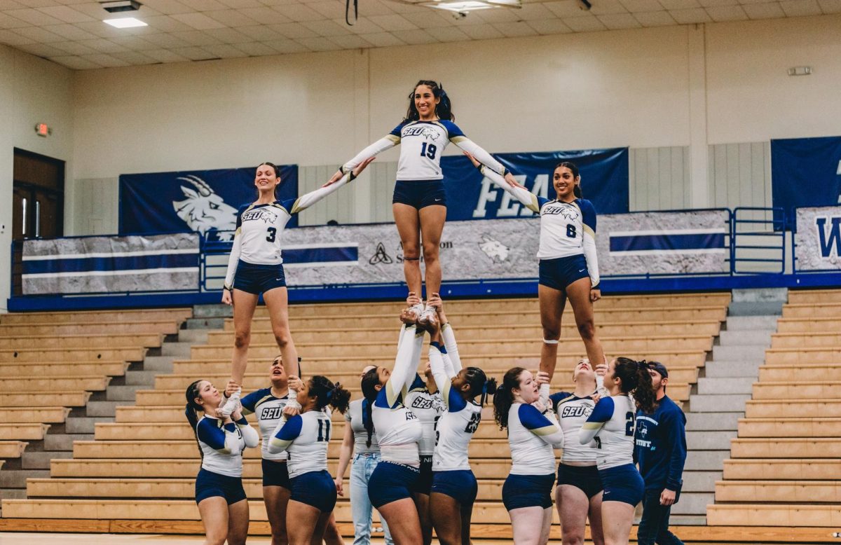 The Hilltoppers STUNT team in action, showcasing their teamwork and dedication as they continue to grow as a team and gain experience in their first ever season of competition.